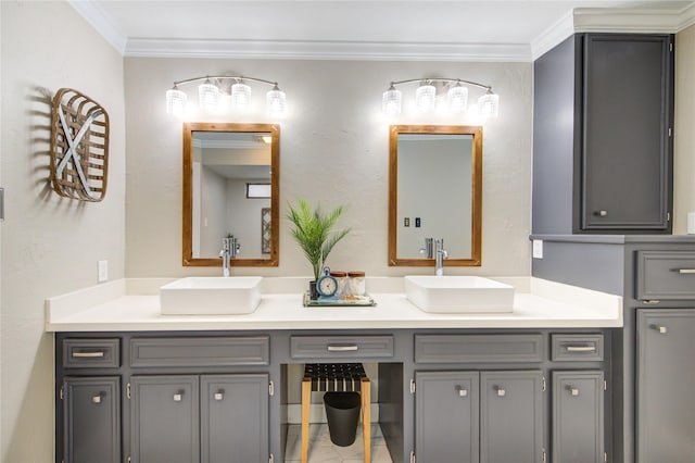 full bathroom with a sink, crown molding, and double vanity