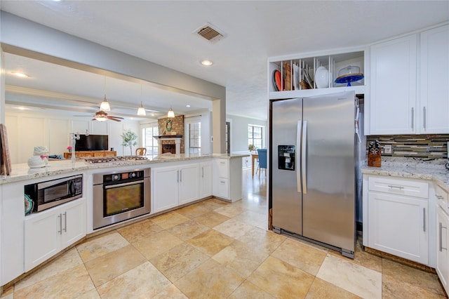 kitchen featuring visible vents, white cabinetry, appliances with stainless steel finishes, and a healthy amount of sunlight
