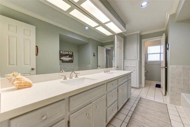 bathroom featuring double vanity, a sink, tile patterned floors, and ornamental molding