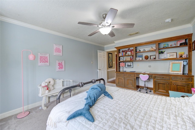bedroom featuring light colored carpet, built in desk, baseboards, visible vents, and ornamental molding