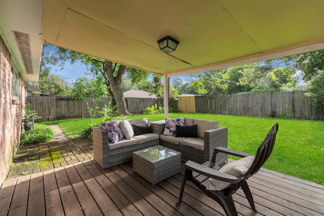 wooden deck featuring a fenced backyard, a patio area, a yard, and an outdoor hangout area