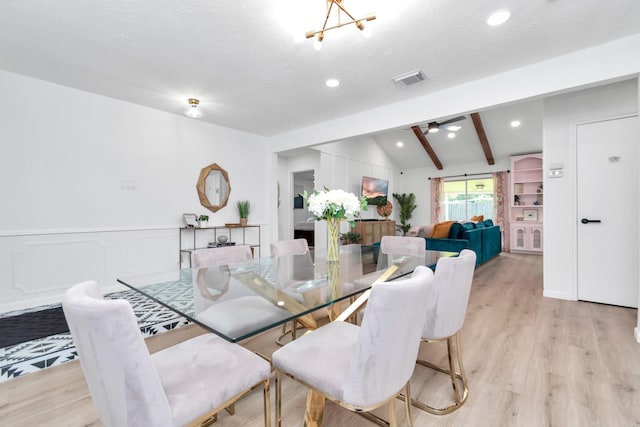 dining area with ceiling fan, lofted ceiling with beams, light wood-style flooring, recessed lighting, and visible vents