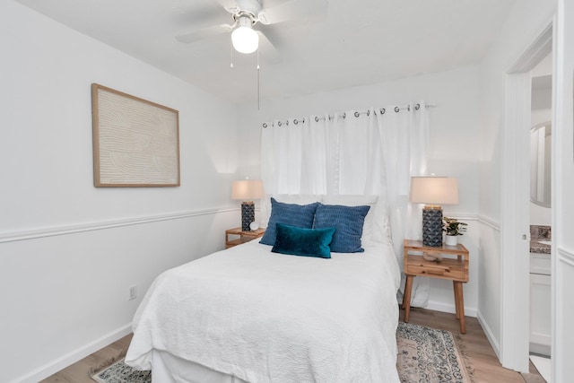 bedroom with light wood finished floors and ceiling fan