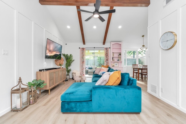 living room featuring vaulted ceiling with beams, ceiling fan, light wood-type flooring, and visible vents