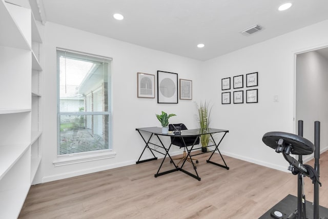 office area with recessed lighting, baseboards, visible vents, and light wood-style flooring