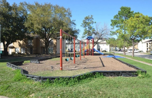 community jungle gym featuring a yard