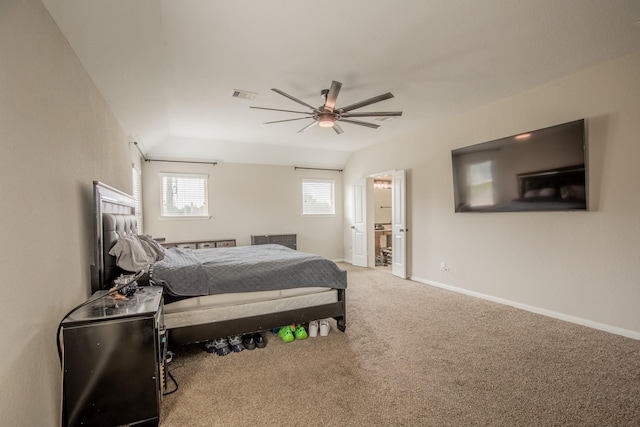 bedroom with ensuite bath, carpet floors, a ceiling fan, baseboards, and visible vents
