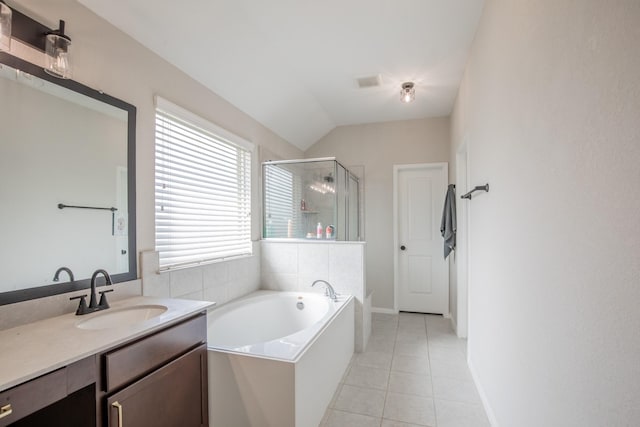 bathroom with tile patterned flooring, vanity, a garden tub, baseboards, and a shower stall