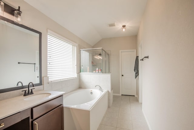 full bathroom with vanity, tile patterned floors, a bath, a stall shower, and vaulted ceiling