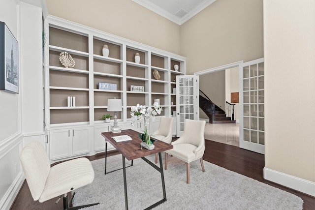 living area with crown molding, dark wood-style floors, stairway, and french doors