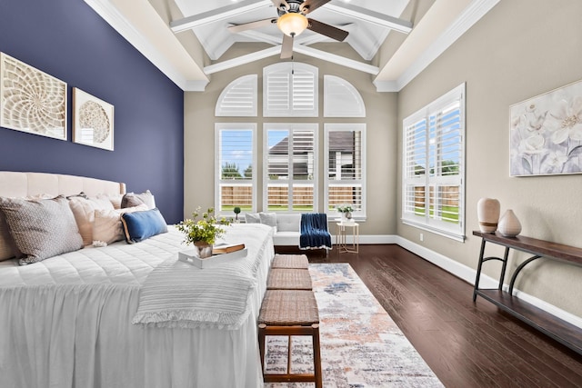 bedroom featuring baseboards, multiple windows, dark wood finished floors, and beam ceiling