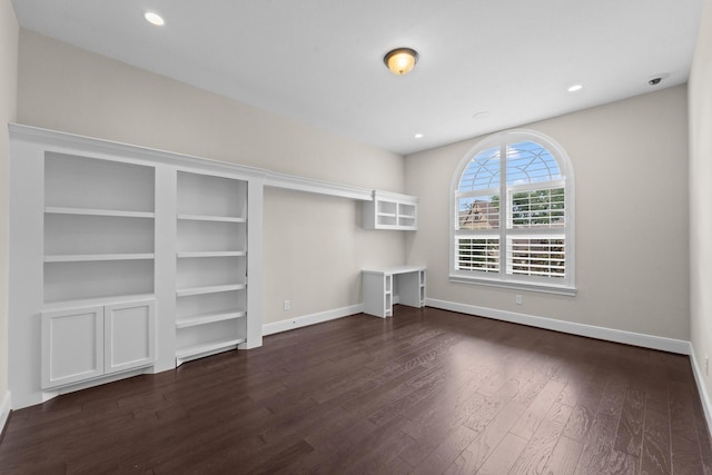 interior space featuring recessed lighting, baseboards, and dark wood-style floors