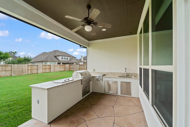 view of patio featuring ceiling fan, fence, a sink, and area for grilling
