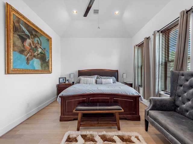 bedroom featuring visible vents, light wood-style flooring, recessed lighting, baseboards, and vaulted ceiling