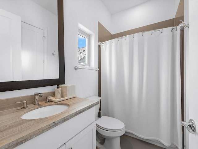 full bath featuring toilet, a shower with shower curtain, and vanity
