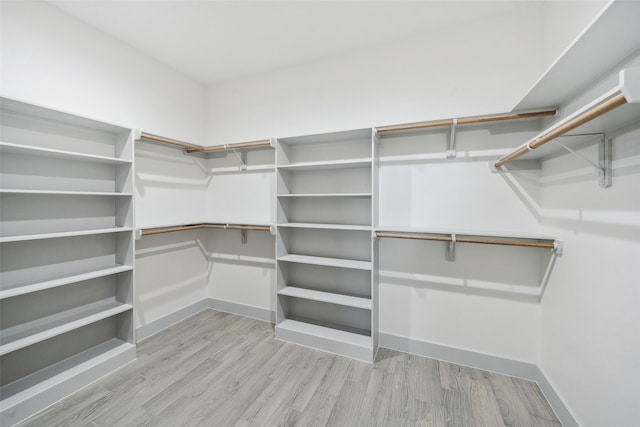 walk in closet featuring light wood-style floors