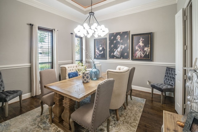 dining area with crown molding, baseboards, wood finished floors, and a notable chandelier