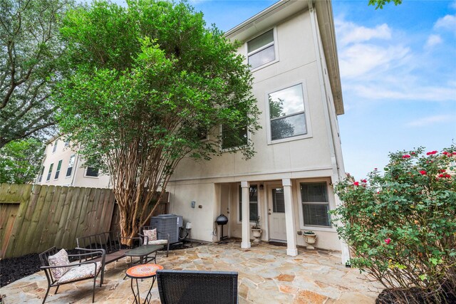 7824 Stoneyway Dr, Houston, TX 77040 - back of house with a patio, stucco siding, fence, and central air condition unit