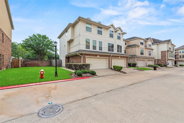 7824 Stoneyway Dr, Houston, TX 77040 - view of front of house with fence, brick siding, a garage, a front yard, and concrete driveway