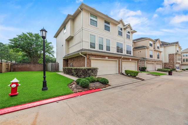7824 Stoneyway Dr, Houston, TX 77040 - view of property featuring fence, an attached garage, brick siding, a front yard, and concrete driveway