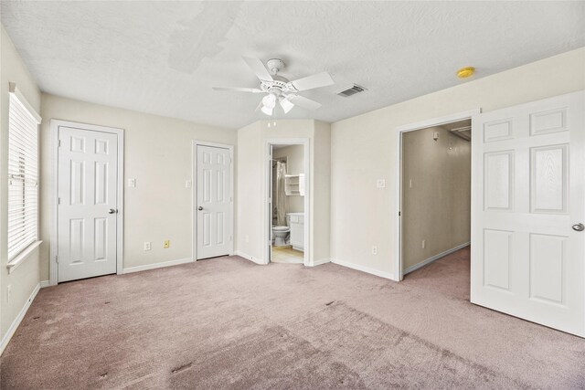 7824 Stoneyway Dr, Houston, TX 77040 - unfurnished bedroom with multiple windows, carpet flooring, and visible vents