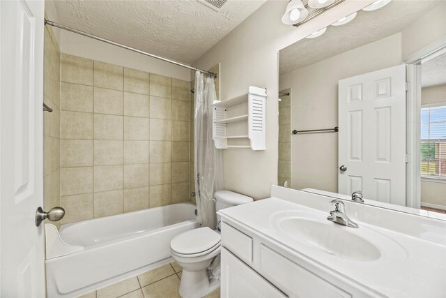 7824 Stoneyway Dr, Houston, TX 77040 - full bathroom with vanity, toilet, a textured ceiling, tile patterned floors, and shower / bath combo