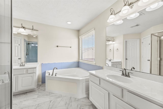 7824 Stoneyway Dr, Houston, TX 77040 - bathroom featuring a garden tub, a sink, a stall shower, and visible vents