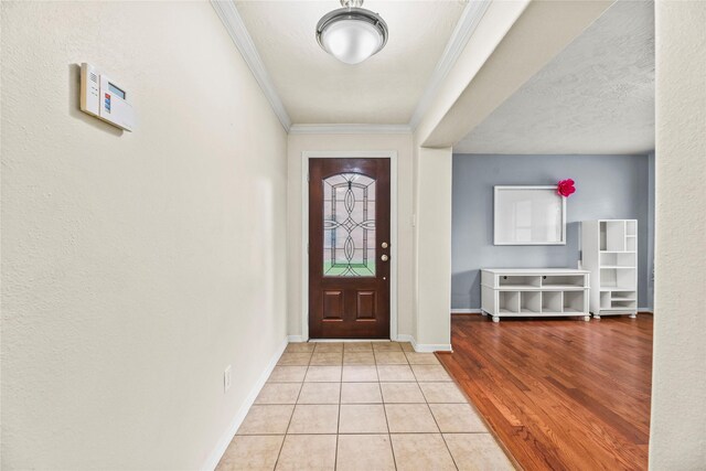 7824 Stoneyway Dr, Houston, TX 77040 - entryway with baseboards, ornamental molding, and light tile patterned floors