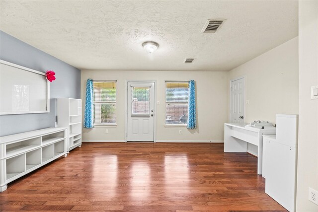 7824 Stoneyway Dr, Houston, TX 77040 - interior space with visible vents, a textured ceiling, and wood finished floors
