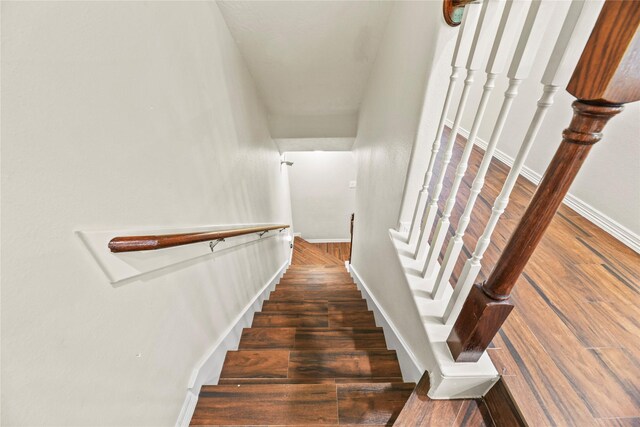 7824 Stoneyway Dr, Houston, TX 77040 - stairway with baseboards and wood finished floors