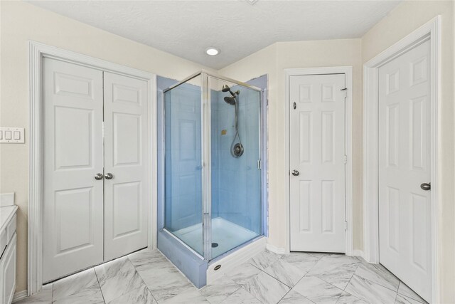 7824 Stoneyway Dr, Houston, TX 77040 - bathroom featuring a stall shower and marble finish floor