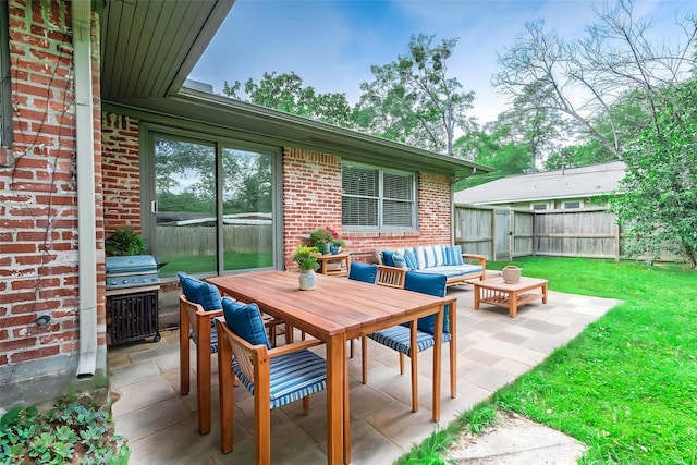 view of patio featuring fence and an outdoor living space