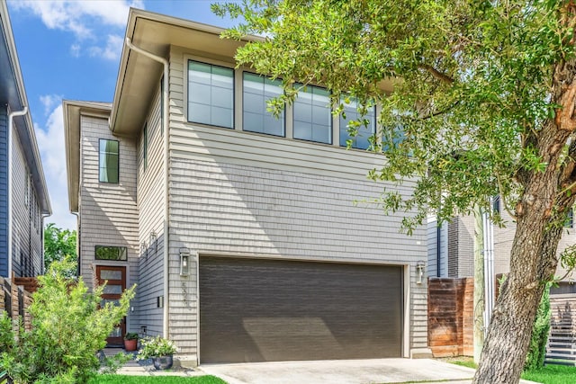view of front of home featuring a garage and concrete driveway