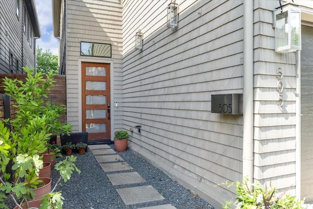 doorway to property with fence