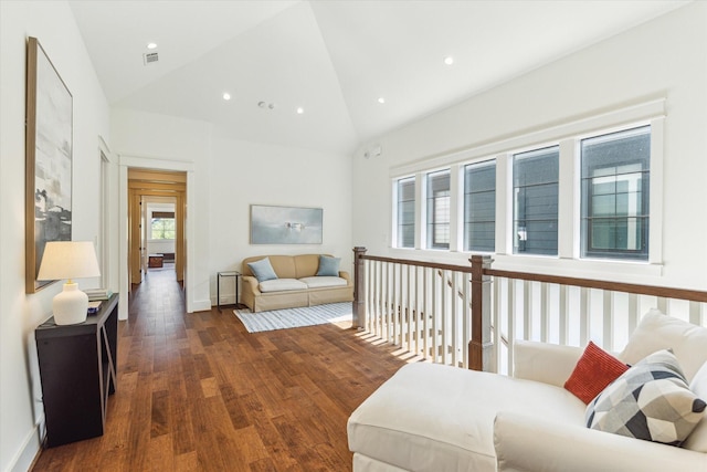 living area with a healthy amount of sunlight, recessed lighting, wood finished floors, and visible vents