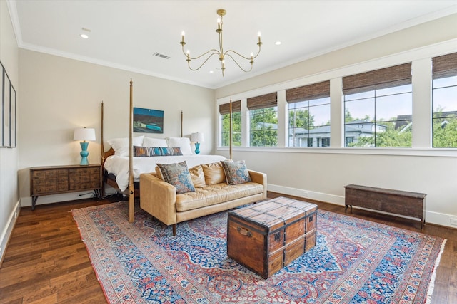 bedroom featuring crown molding, baseboards, a chandelier, and wood finished floors