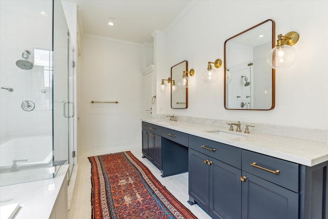 full bathroom featuring a sink, ornamental molding, a shower stall, and double vanity