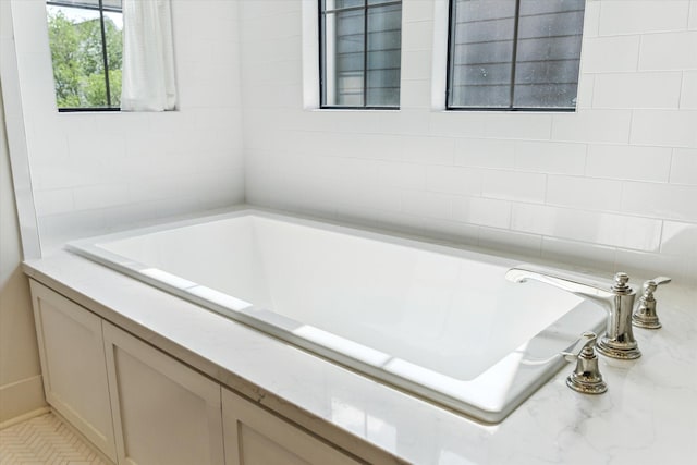bathroom featuring a garden tub