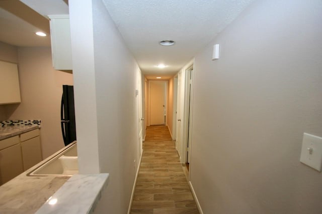 12024 Mighty Oak Dr Unit A, Houston, TX 77066 - corridor with a sink, baseboards, light wood finished floors, and recessed lighting