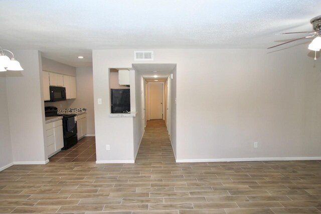 12024 Mighty Oak Dr Unit A, Houston, TX 77066 - interior space featuring ceiling fan, open floor plan, baseboards, visible vents, and black appliances
