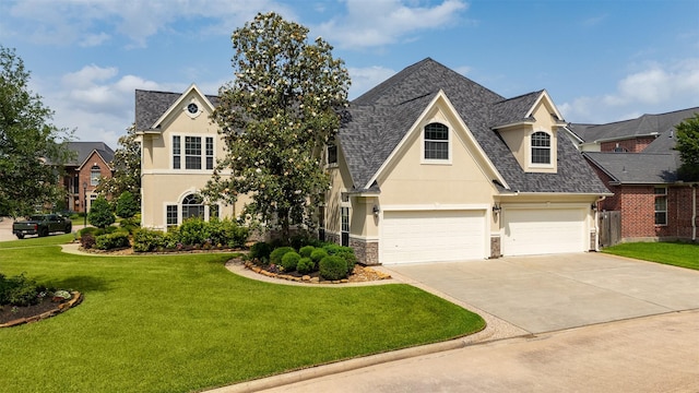 5811 Cimmaron Creek Ct, Spring, TX 77379 - view of front of home featuring driveway, a front lawn, a shingled roof, stone siding, and stucco siding