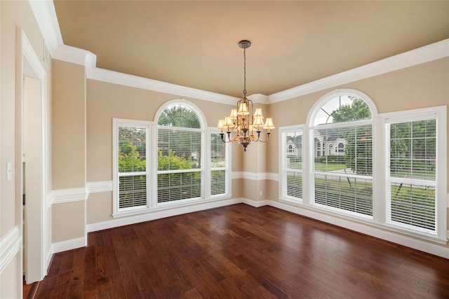 5811 Cimmaron Creek Ct, Spring, TX 77379 - unfurnished dining area featuring baseboards, dark wood-style flooring, crown molding, and a chandelier