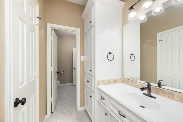5811 Cimmaron Creek Ct, Spring, TX 77379 - bathroom with vanity, baseboards, tile patterned floors, and toilet