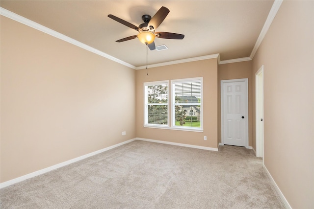 5811 Cimmaron Creek Ct, Spring, TX 77379 - spare room featuring ceiling fan, light colored carpet, visible vents, baseboards, and ornamental molding