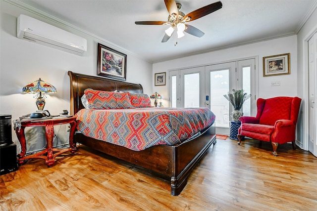 bedroom featuring an AC wall unit, ornamental molding, wood finished floors, and access to exterior