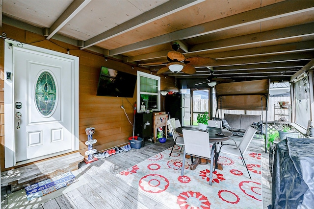 wooden deck featuring a ceiling fan and outdoor dining area