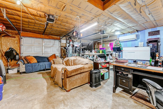 garage featuring a garage door opener and a wall mounted air conditioner