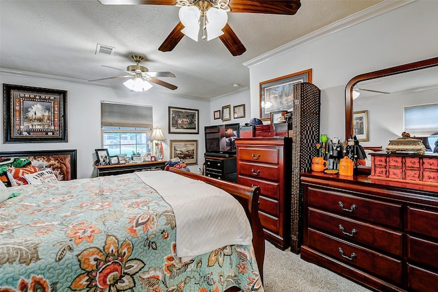 carpeted bedroom with crown molding, a textured ceiling, and visible vents