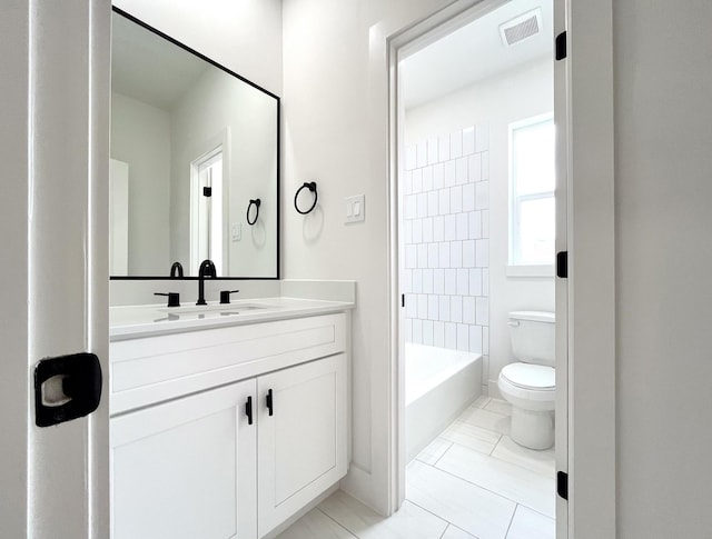full bath with toilet, visible vents, and vanity