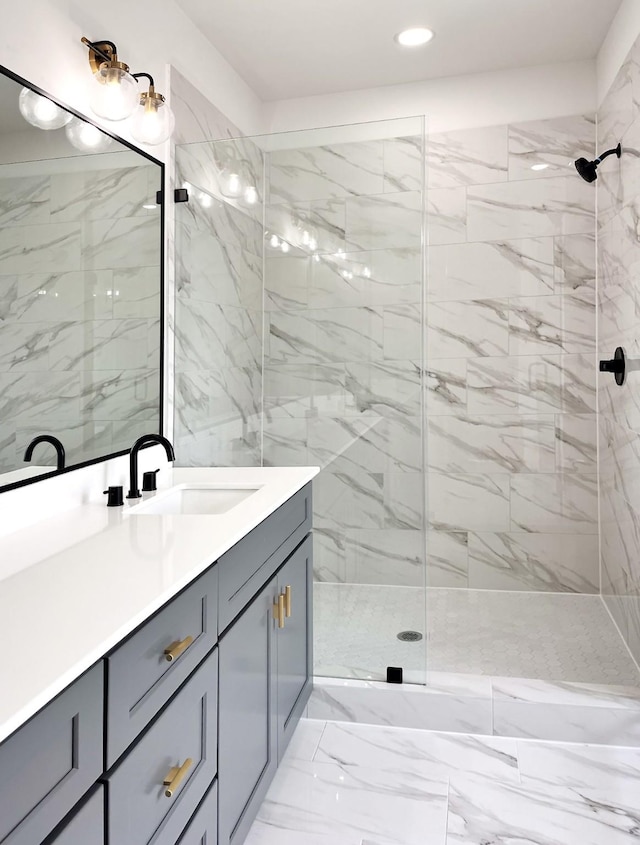 full bath with recessed lighting, a shower stall, marble finish floor, and vanity